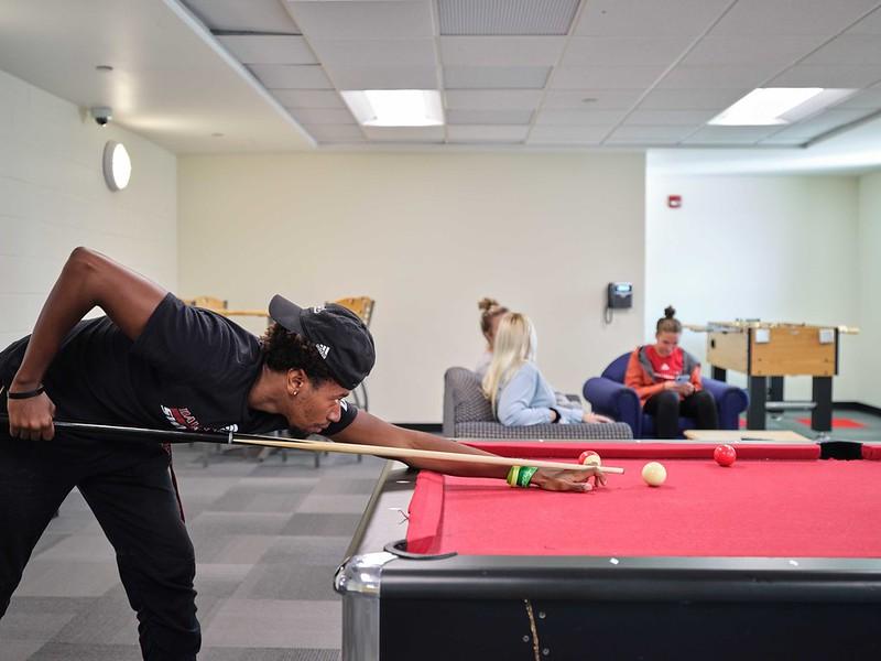 Student playing pool