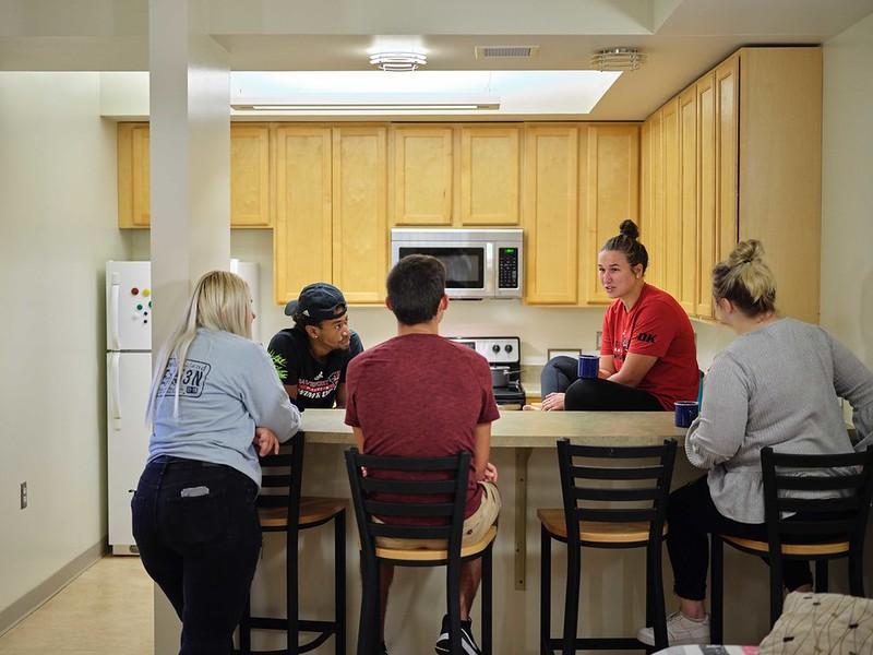 Students in a room talking