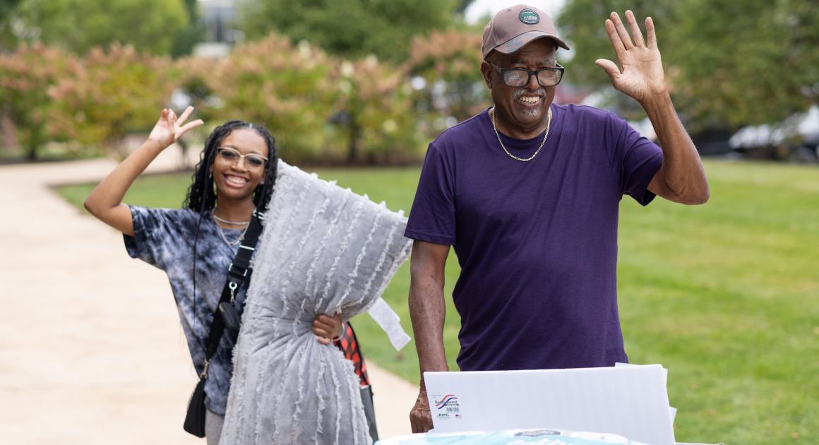 A student and their grandfather on move in day